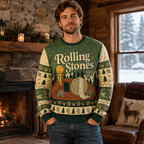 man wearing a rolling stones ugly christmas sweater in a cabin