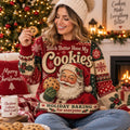 woman holding a cookie in a red santa ugly christmas sweater