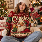 woman laughing in a holiday baking christmas sweater with cocoa