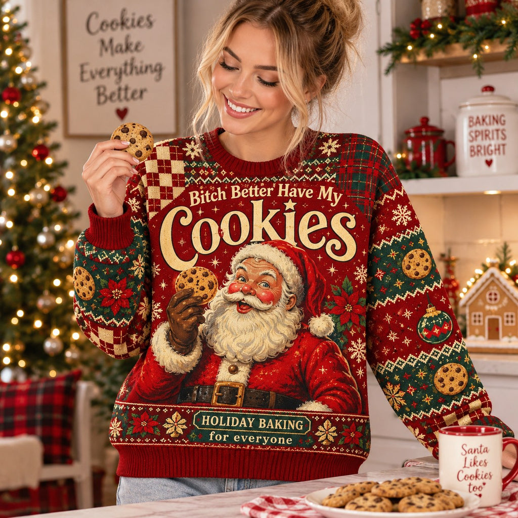smiling woman holding a chocolate chip cookie wearing a sublimation print holiday