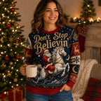 woman holding mug in front of lit christmas tree wearing ugly christmas