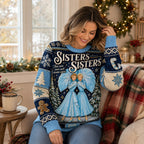 seated woman in sisters sisters christmas sweater beside a window with garland