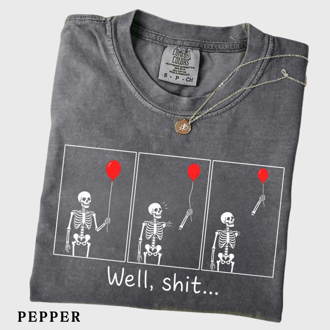 folded pepper grey graphic tee with skeleton and red balloon comic print