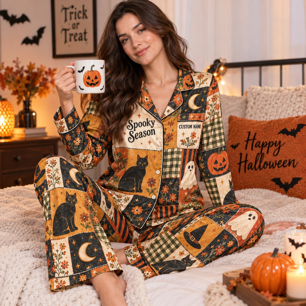 halloween satin pajama set in bed with jack o lantern mug