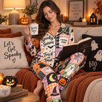 woman reading book on couch in halloween satin pajamas with spooky vibes
