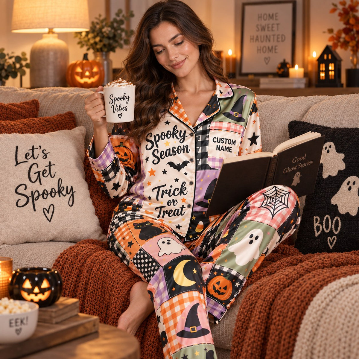 woman reading book on couch in halloween satin pajamas with spooky vibes