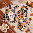 flat lay halloween patchwork satin pajamas with a custom name on the chest