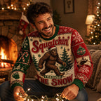 man seated by fireplace smiling in ugly christmas sweater with sasquatch forest