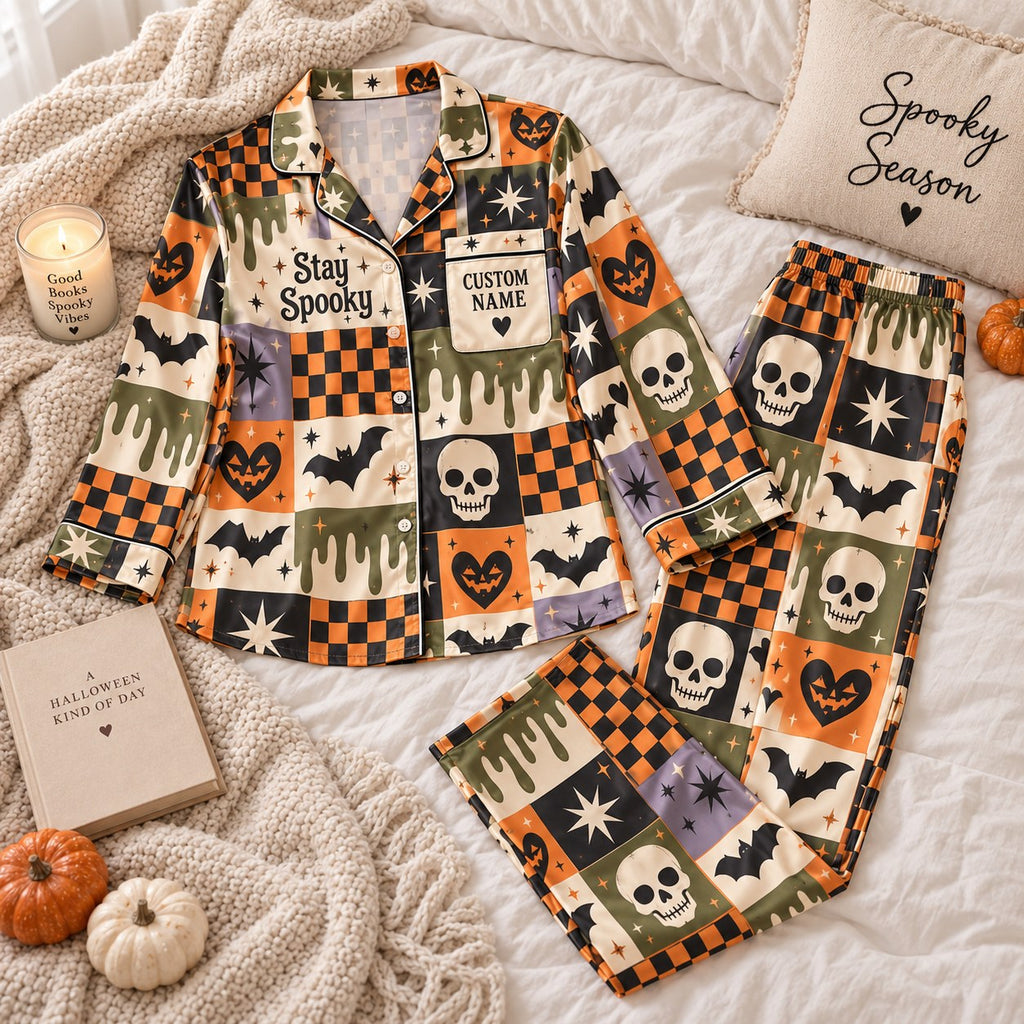 flat lay skull and checkerboard satin pajamas with a custom name on the chest