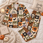 flat lay skull and checkerboard satin pajamas with a custom name on the chest