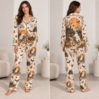 woman modeling Stay Spooky Halloween satin pajama set with all-over ghost pumpkin