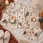 cream ghost bicycle satin pajamas flat lay with a custom name on the chest