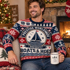 close up of a prestige worldwide holiday sweater with nautical sailboat badge