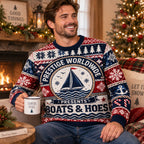 seated man in a step brothers boats and hoes christmas pullover smiling