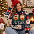 model wearing a navy ugly christmas sweater with two reindeer and the