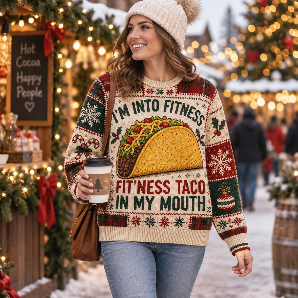 woman smiling outdoors at a christmas market wearing the taco holiday sweater