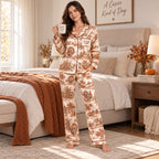 back view of matching satin pajamas covered in autumn leaves and harvest
