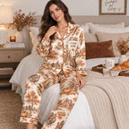 woman sitting on a bed reading in a personalized thanksgiving harvest satin