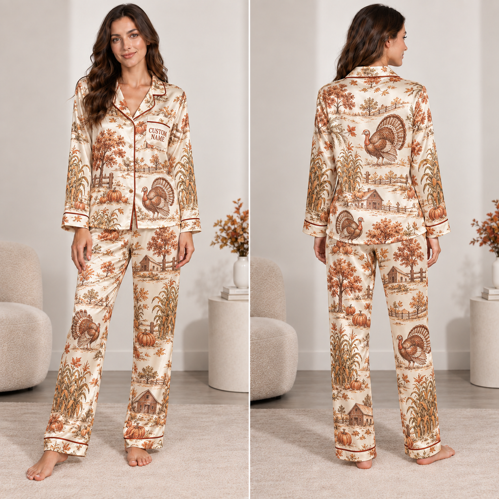 woman wearing a thanksgiving turkey and pumpkin satin pajama set