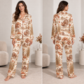 woman wearing a thanksgiving turkey and pumpkin satin pajama set