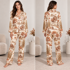 woman wearing a thanksgiving turkey and pumpkin satin pajama set
