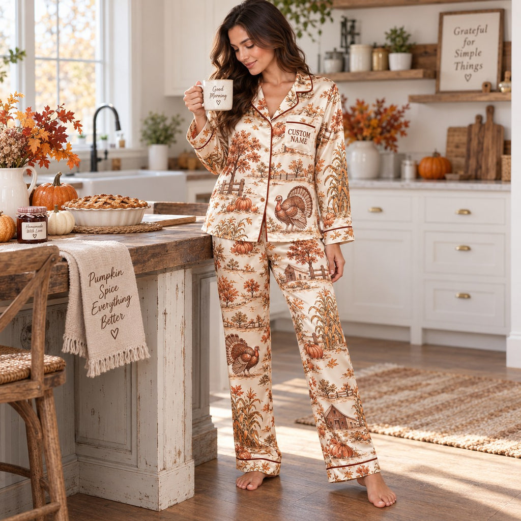 woman sitting on a bed holding a good morning mug in thanksgiving