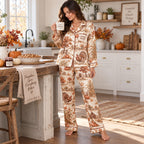 woman sitting on a bed holding a good morning mug in thanksgiving