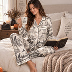 back view of halloween satin pajamas showing escaped since 1692 three witches