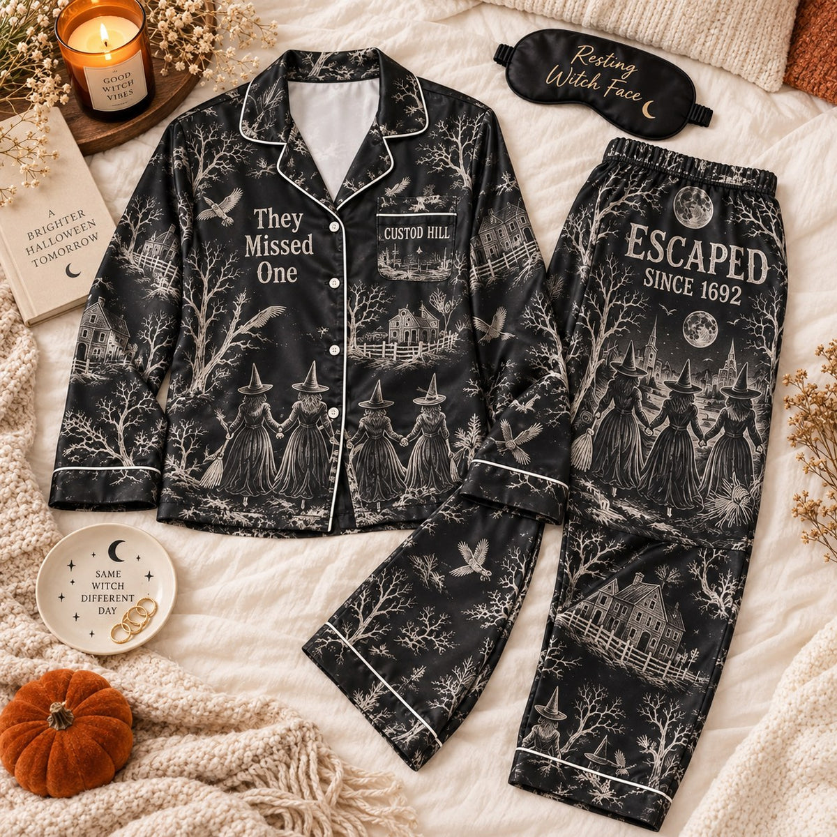 black witch toile satin pajama set flat lay with Escaped Since 1692 on pants