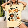 tired moms coffee club halloween graphic tee in pale yellow