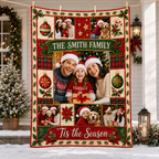 a personalized christmas family blanket hanging on a porch with garland