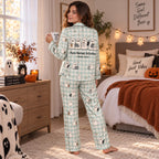 woman on a couch reading a book in a halloween ghost satin