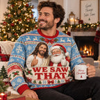 smiling man in a we saw that holiday sweater holding a merry