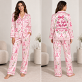 woman modeling pink breast cancer awareness satin pajama set with custom name