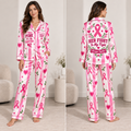 woman modeling a pink and white satin pajama set with all-over breast