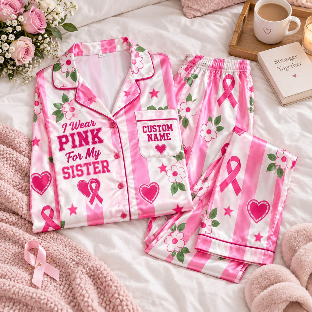 flat lay pink striped ribbon satin pajamas with a custom name on the chest