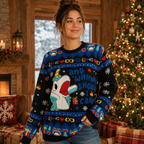 woman smiling in a blue ugly christmas sweater with cartoon character design