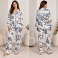 woman wearing a winter village christmas satin pajama set with snow-covered houses