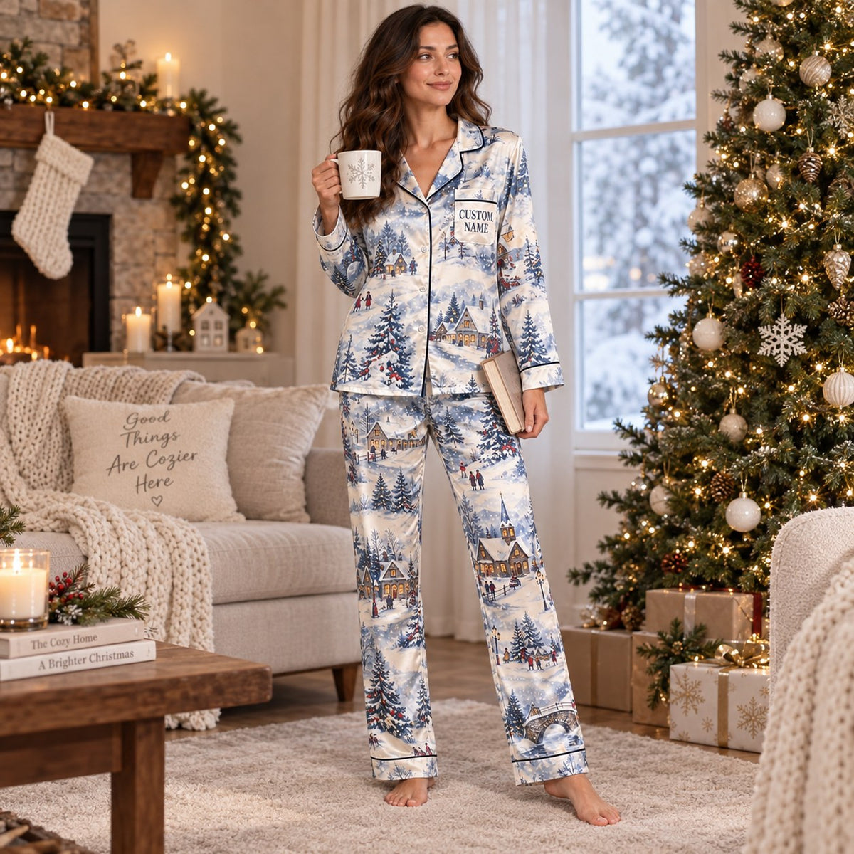 woman sitting on a bed in a winter village christmas pajama set