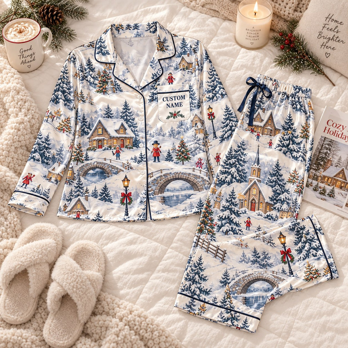 flat lay of snowy village satin pajamas with a custom name on the chest