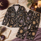 flat lay black celestial crystal satin pajamas with a custom name on the chest