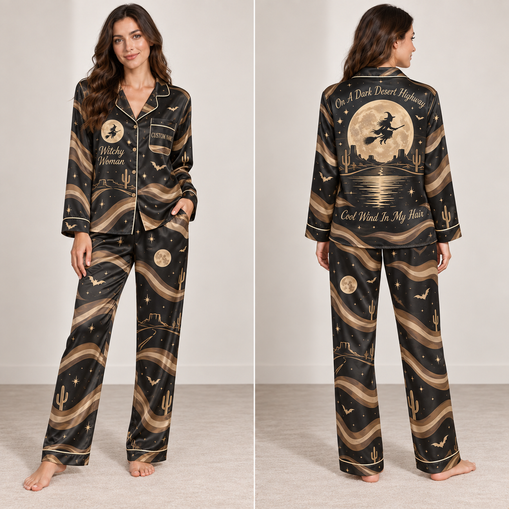 woman modeling a black satin pajama set with an all-over witch moon