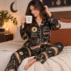 woman in black desert witch satin pajamas with a custom name on the chest