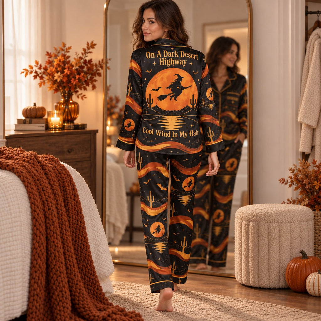 model reading a book on a sofa in witchy woman halloween loungewear
