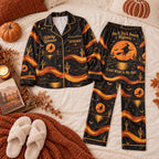 flat lay of black and orange desert witch satin pajama set with cactus print