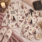 cream moon cat satin pajamas flat lay with a custom name on the chest