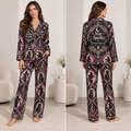woman modeling front view of a witchy woman halloween satin pajama set