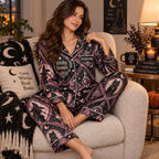 woman seated in an armchair wearing a matching witchy woman halloween satin