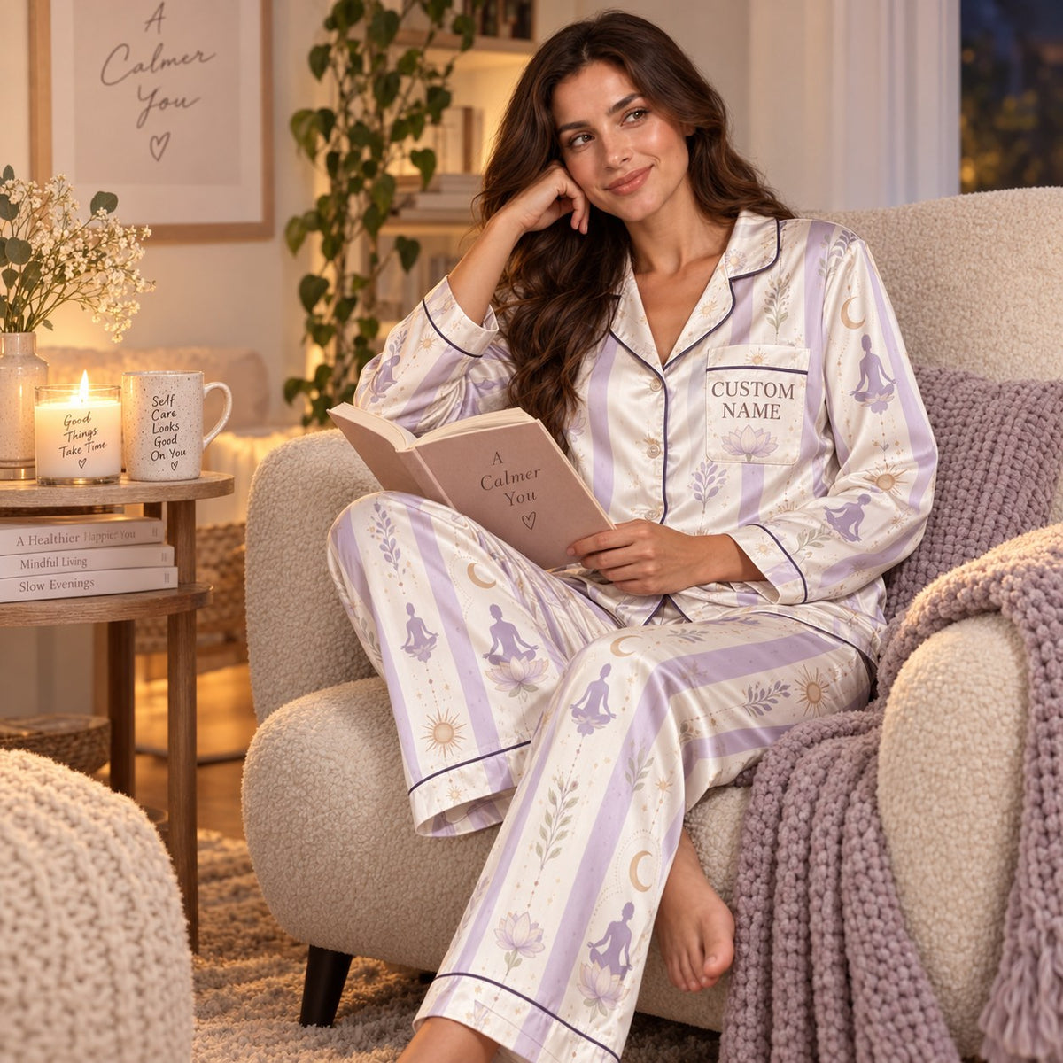 woman reading book in personalized lilac satin pajama set in cozy bedroom